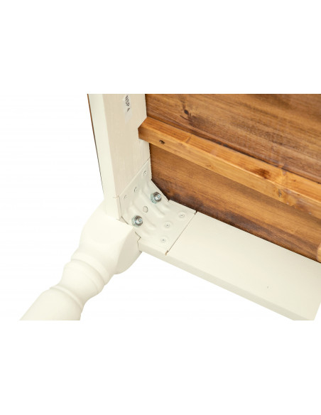Bi-color table with extensions made by hand Made in Italy in solid wood. Detail of the fixing of the leg.